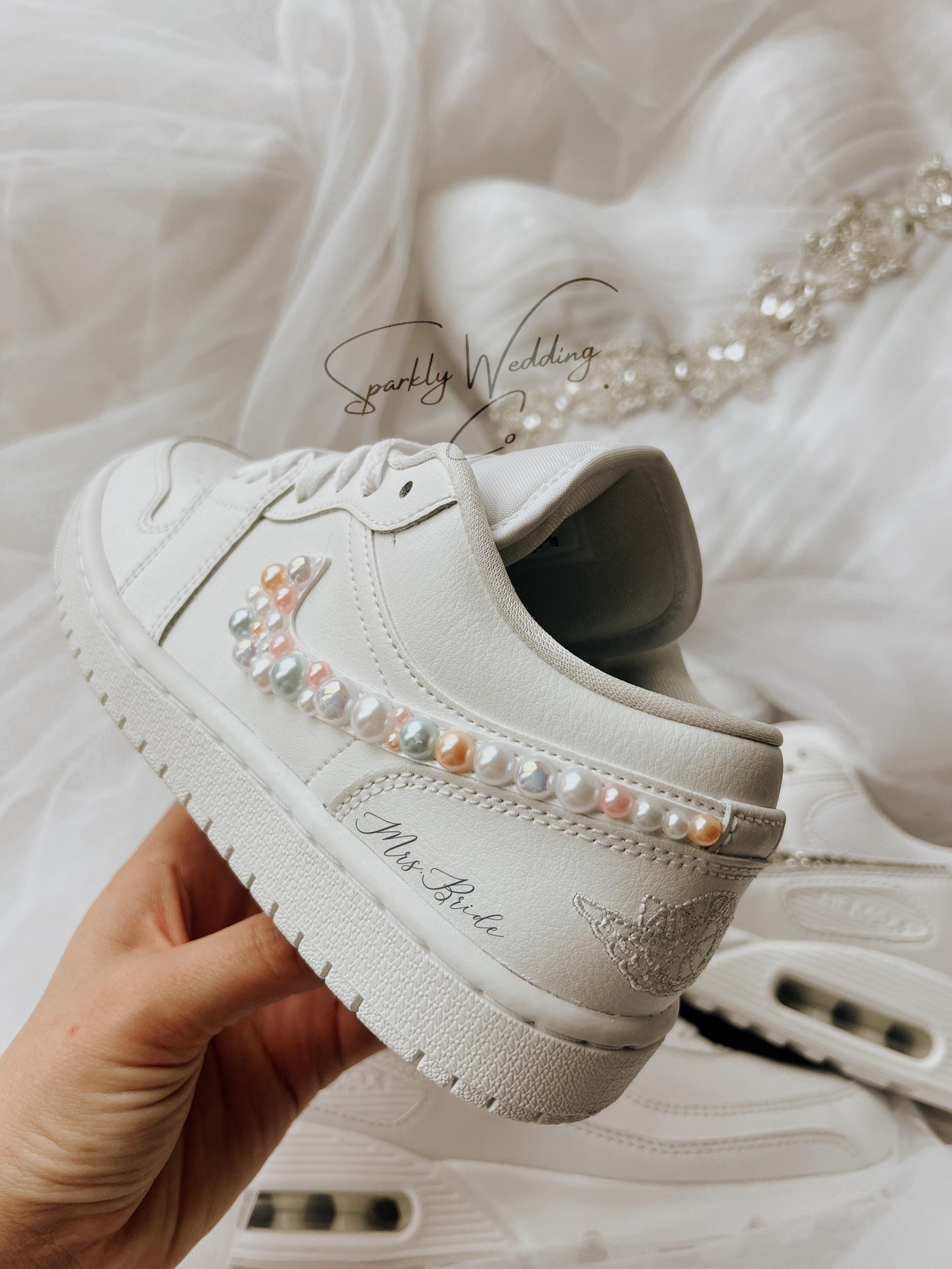 Bridal Nike Air Jordan wedding sneakers styled for a luxury wedding flat lay with soft neutral tones.