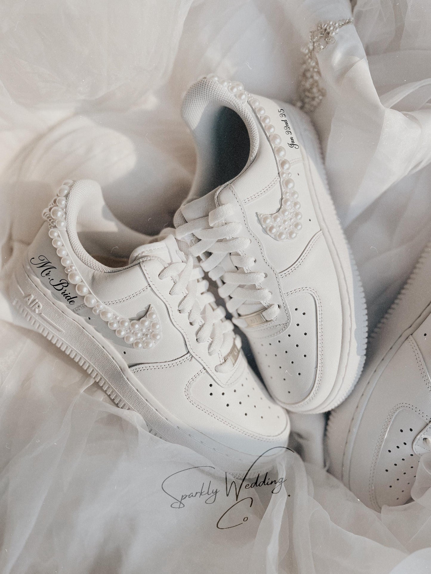 Custom pearl wedding sneakers for bride with pearls on the swoosh and back heel
