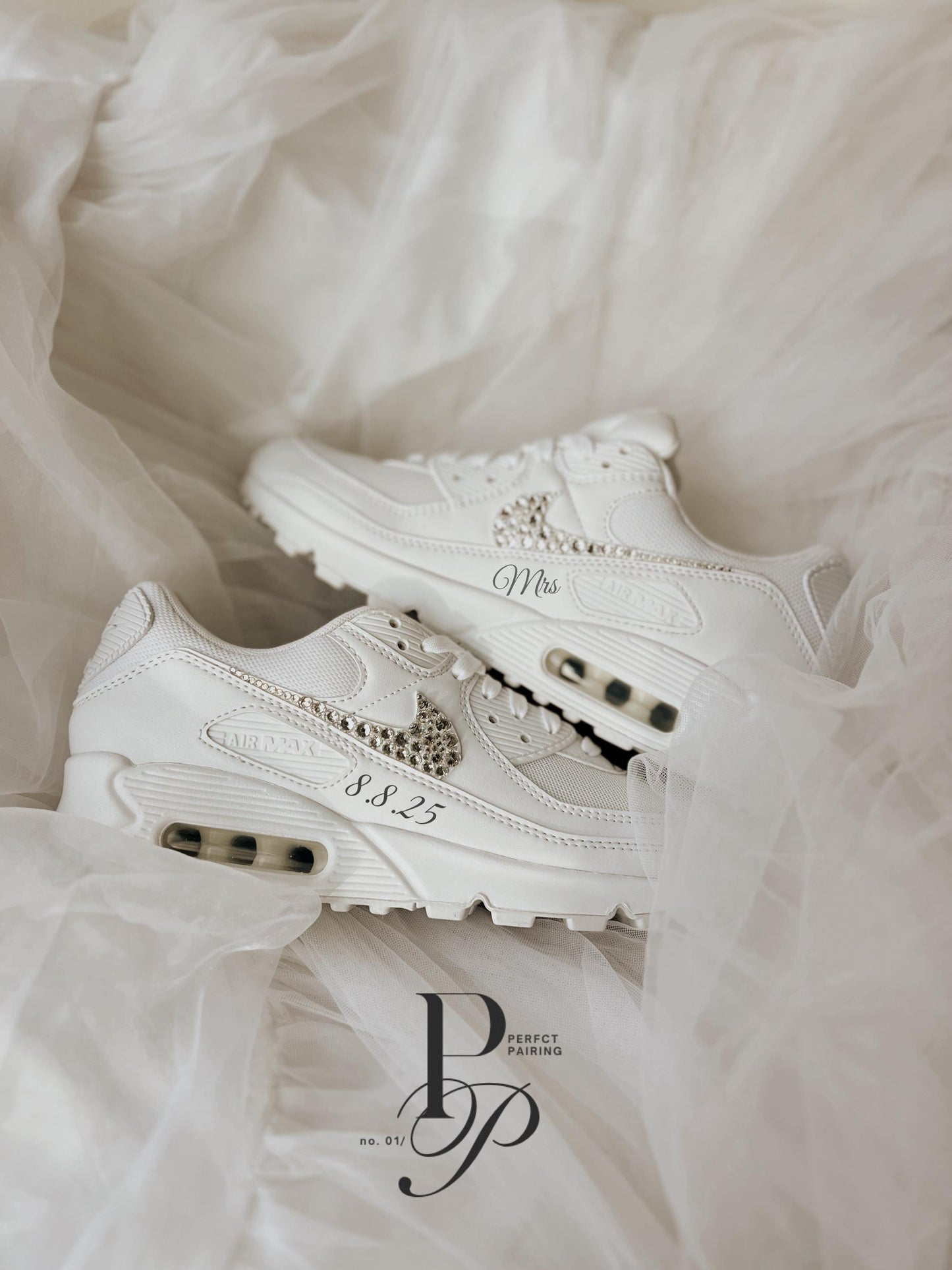 Elegant white Air Max 90 wedding sneakers styled in a bridal flat lay with soft neutral wedding tones.